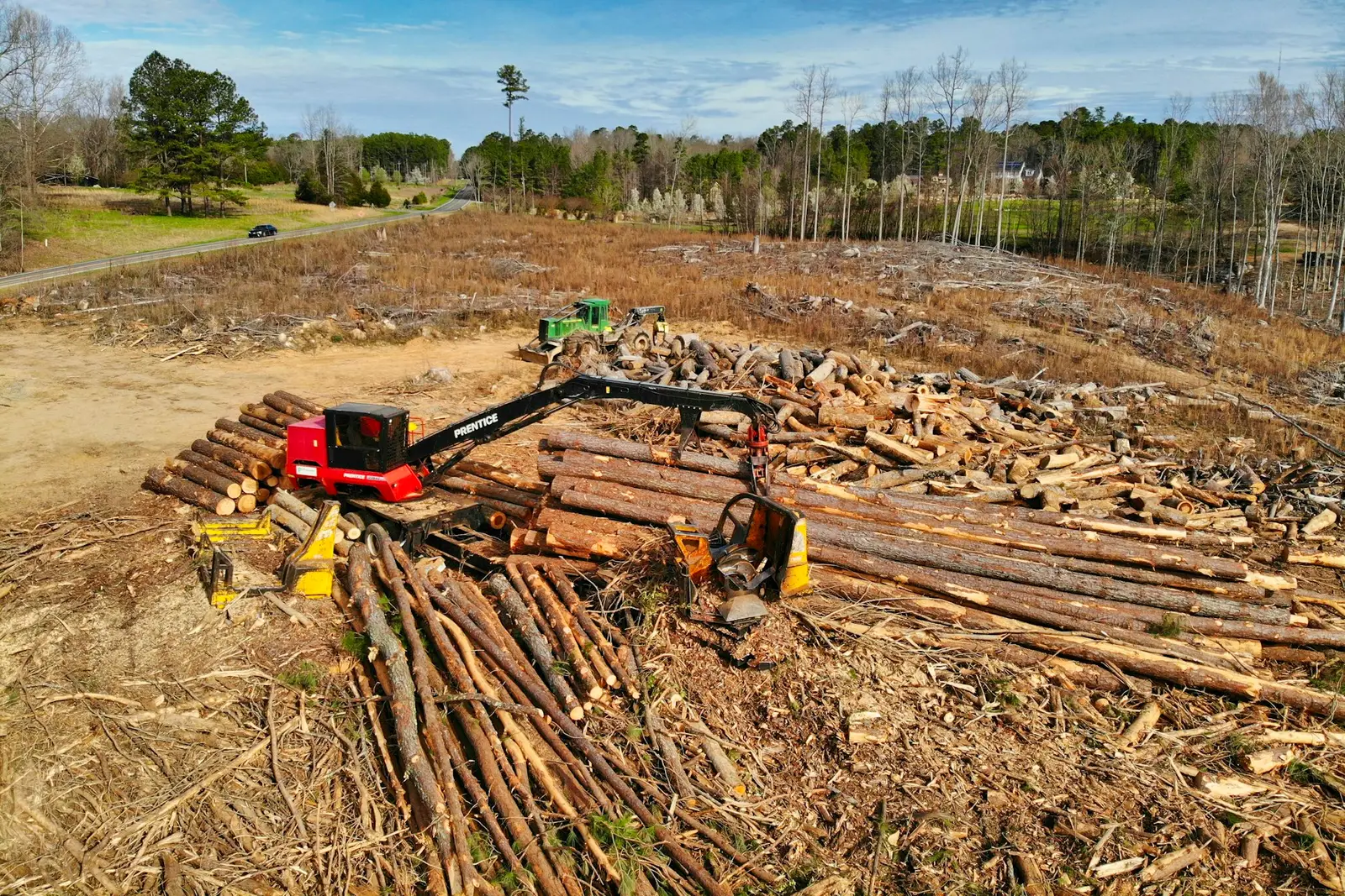 Red heavy equipment on a land clearing site